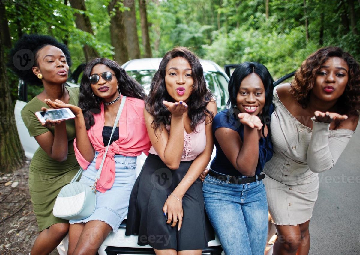 group-of-five-happy-african-american-girls-sitting-on-a-car-hood-photo group-of-five-happy-african-american-girls-sitting-on-a-car-hood-photo